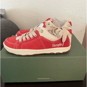 Bright red suede sneakers with natural colored trim.